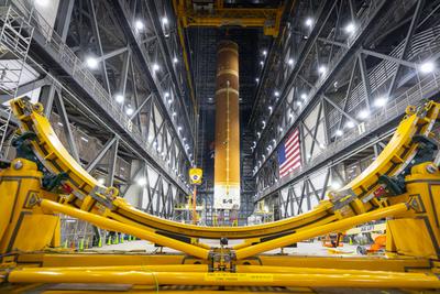Core stage lifted to vertical in the VAB